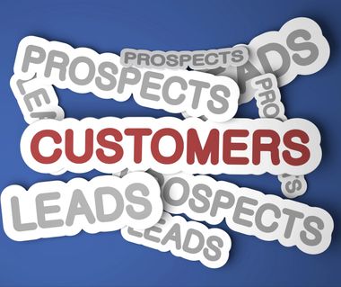 Words “CUSTOMERS,” “PROSPECTS,” and “LEADS” overlapping in red, gray, and white on blue background