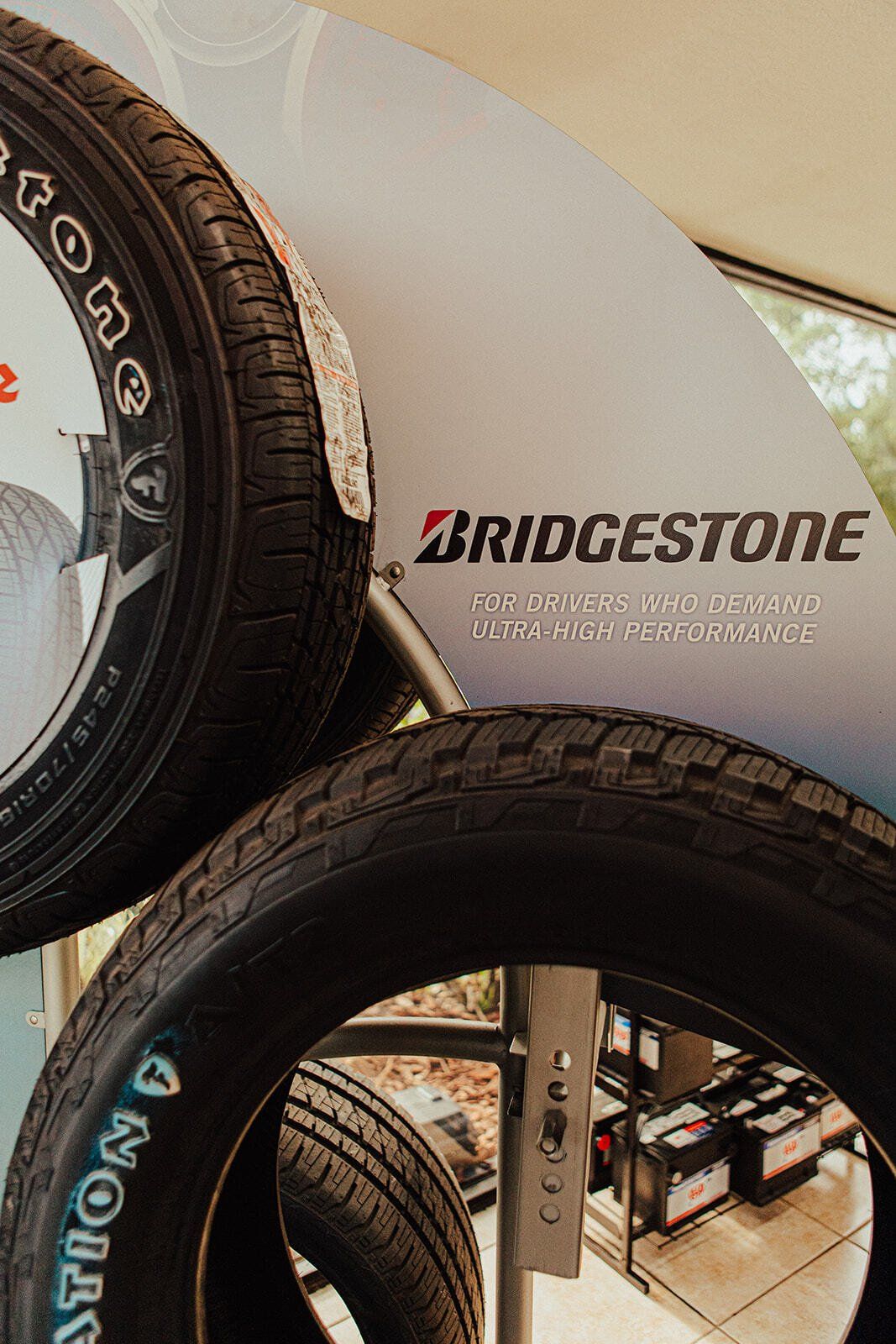 Bridgestone tires displayed on a rack, with the brand logo visible.