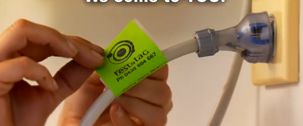 A person attaching a green A person attaching a green