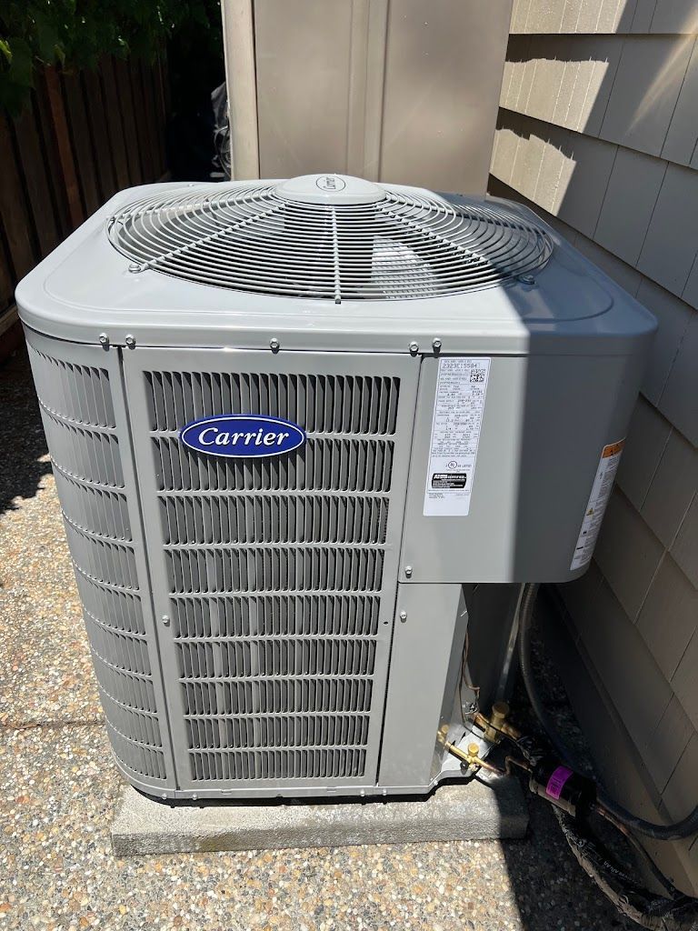 A carrier air conditioner is stacked on top of each other in a room.