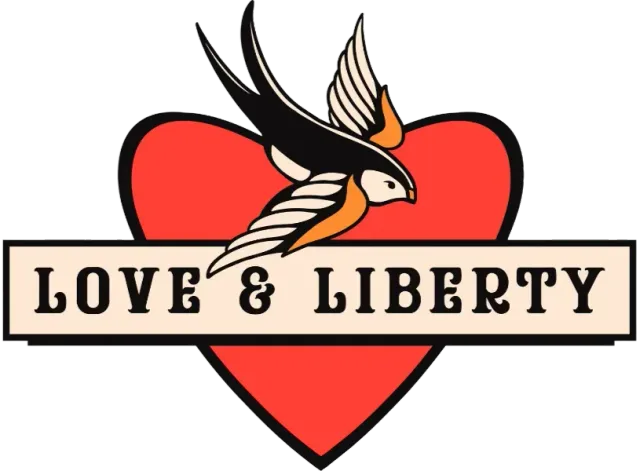 Red heart with a flying bird and banner reading “Love & Liberty”