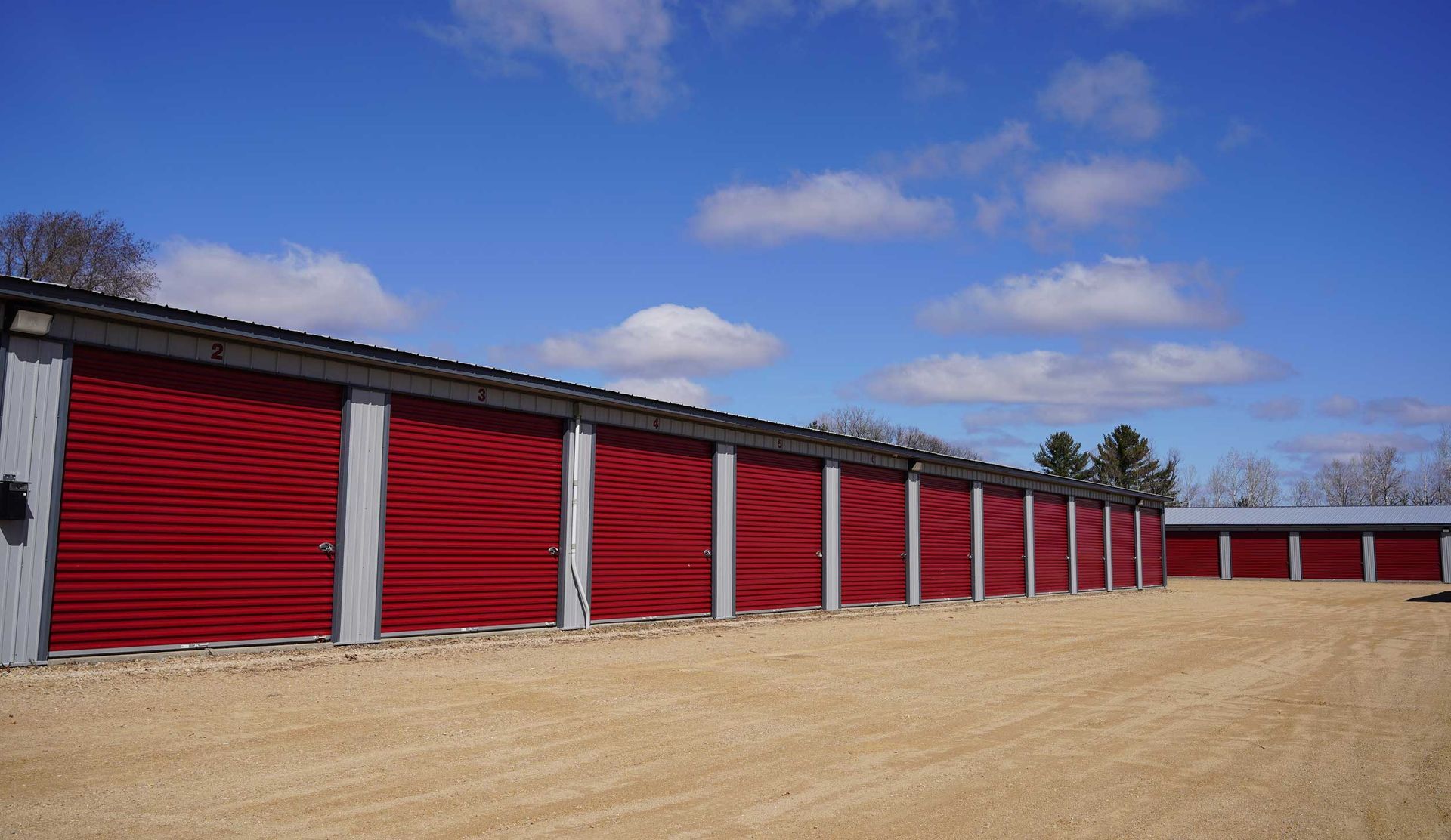 Row of red drive-up storage units.