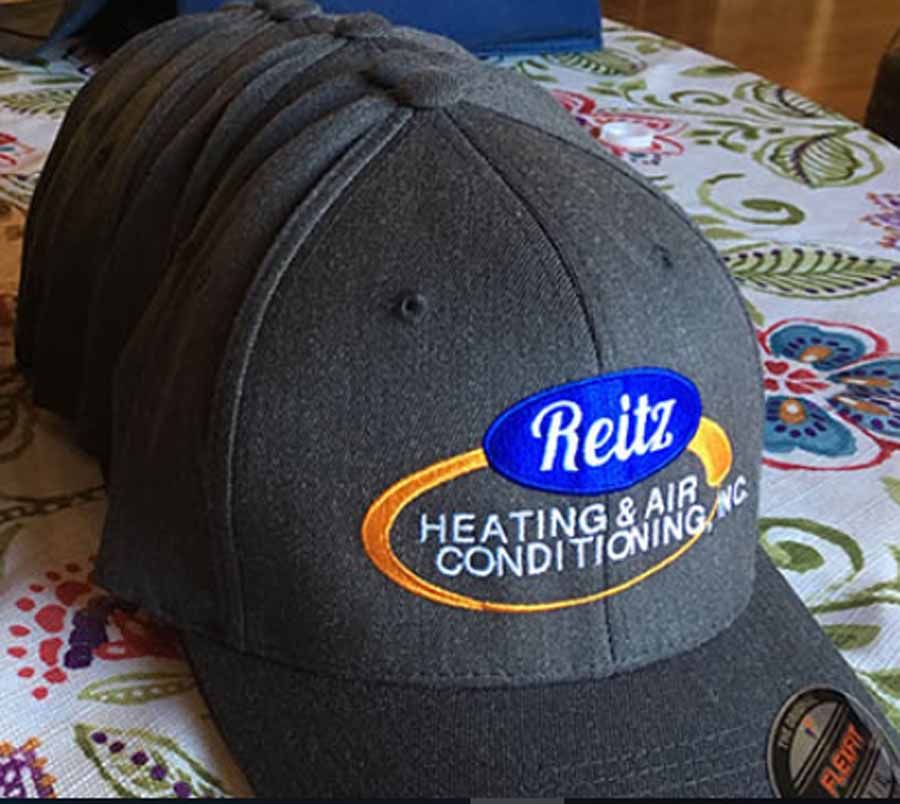 Dark gray baseball cap with a Beitz Heating & Air Conditioning logo on the front