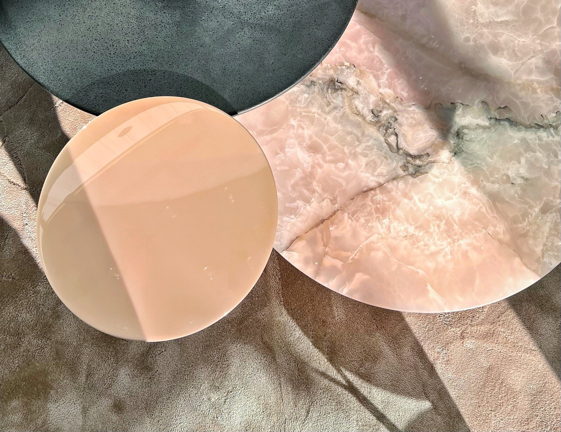 Pink and beige sculptural marble coffee tables viewed from above