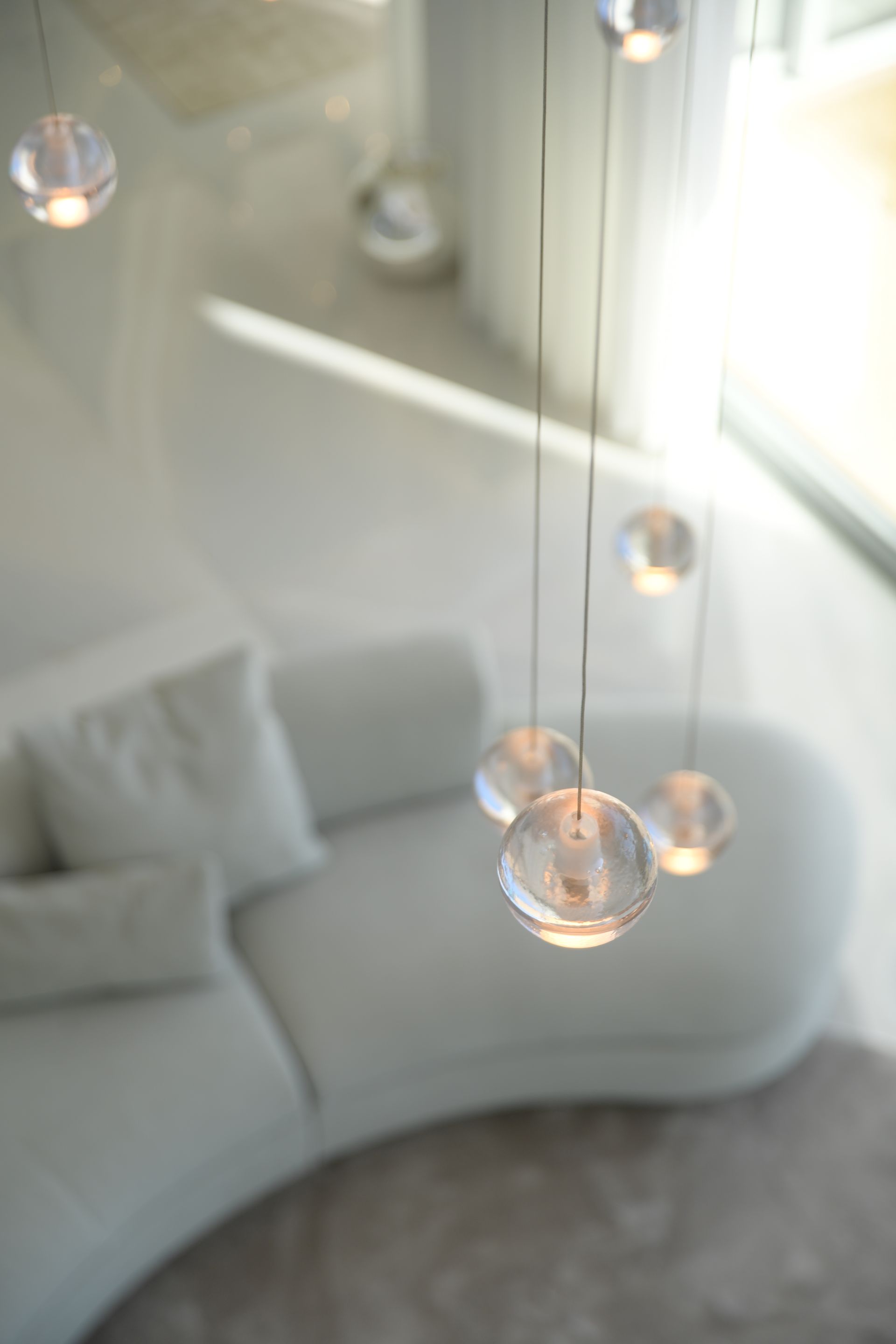 Bocci designer lighting installation in a luxury interior by DÉMARTISTUDIO