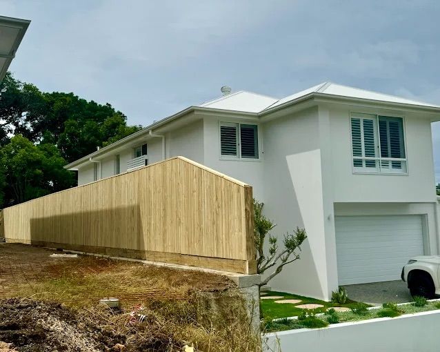 A Wooden Gate In Front Of A House — Ballina Best Fencing In Ballina, NSW