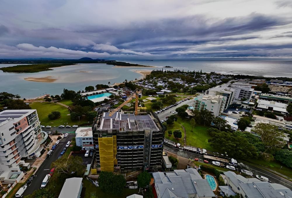 An Aerial View of a City With a Large Body of Water in the Background — All Coast Scaffolding In Yandina, QLD