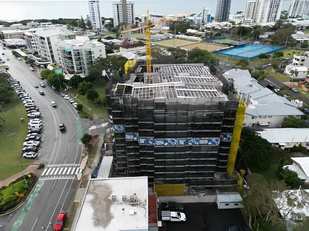 An Aerial View of a Building Under Construction in a City — All Coast Scaffolding In Yandina, QLD