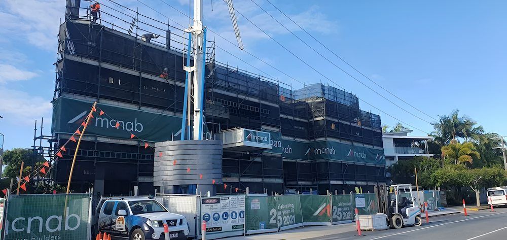 A Large Building is Being Built on the Side of the Road — All Coast Scaffolding In Yandina, QLD