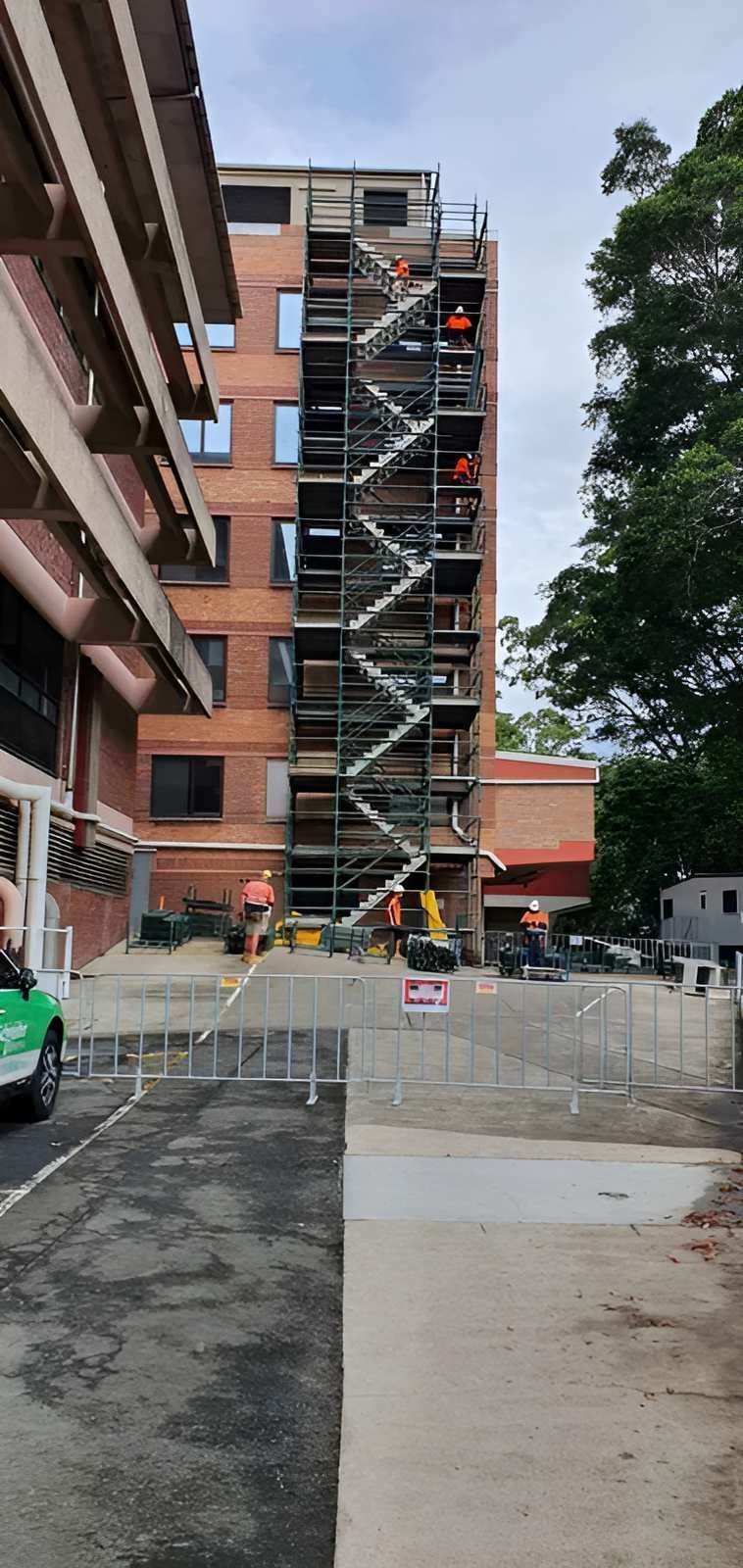 A Large Building is Being Built With Scaffolding Around It — All Coast Scaffolding In Yandina, QLD
