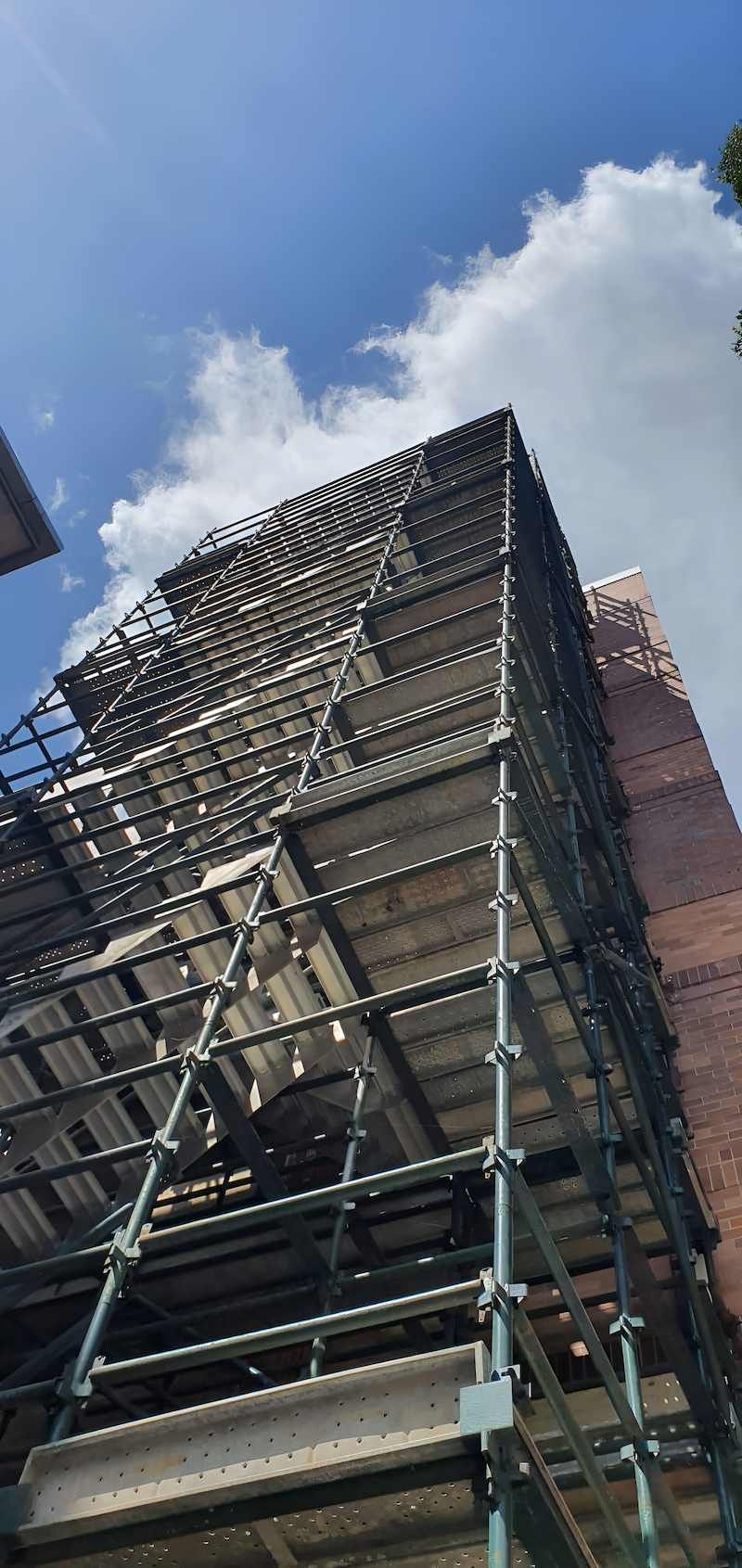 A Building is Being Built With Scaffolding Around It — All Coast Scaffolding In Yandina, QLD