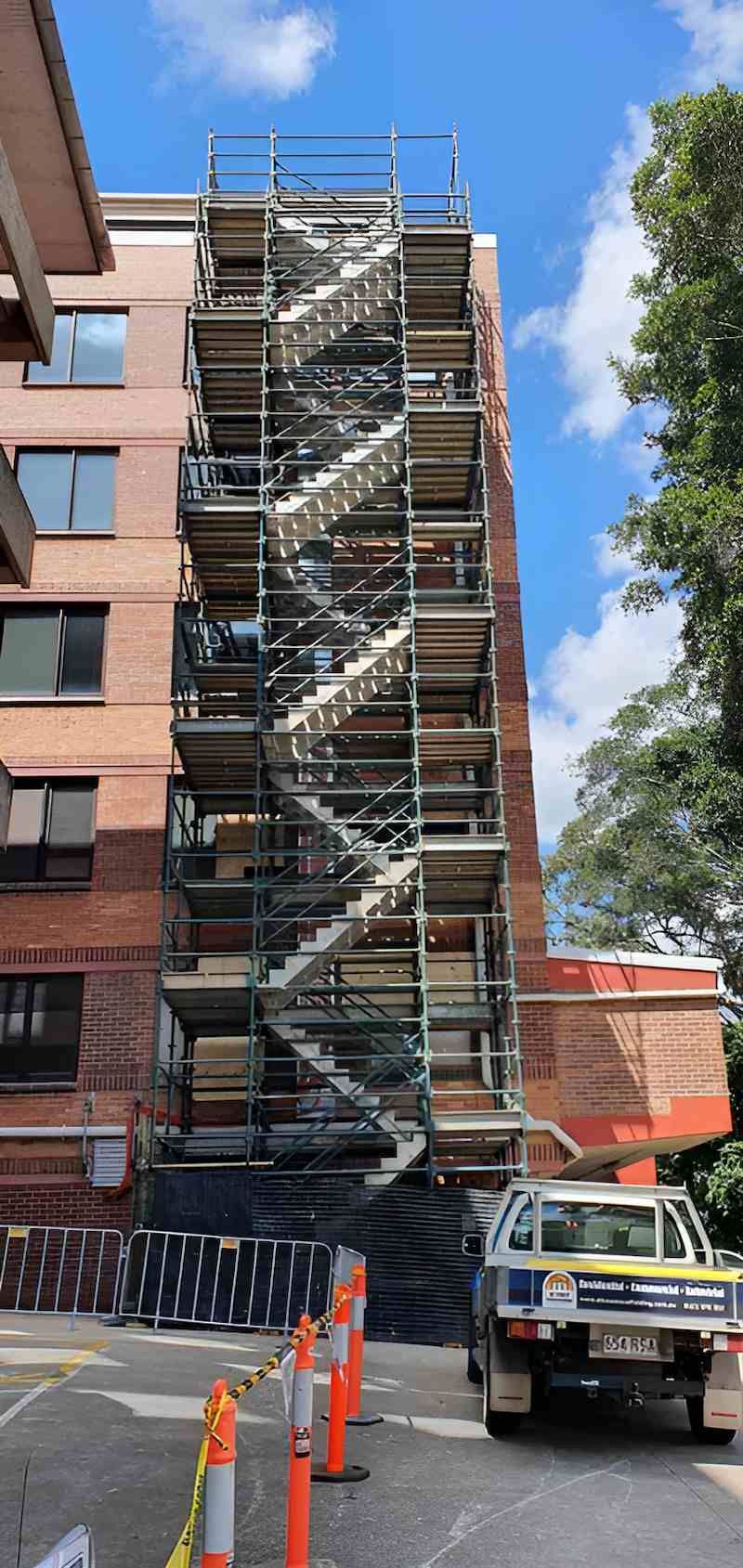 A Large Building is Being Built With Scaffolding Around It — All Coast Scaffolding In Yandina, QLD