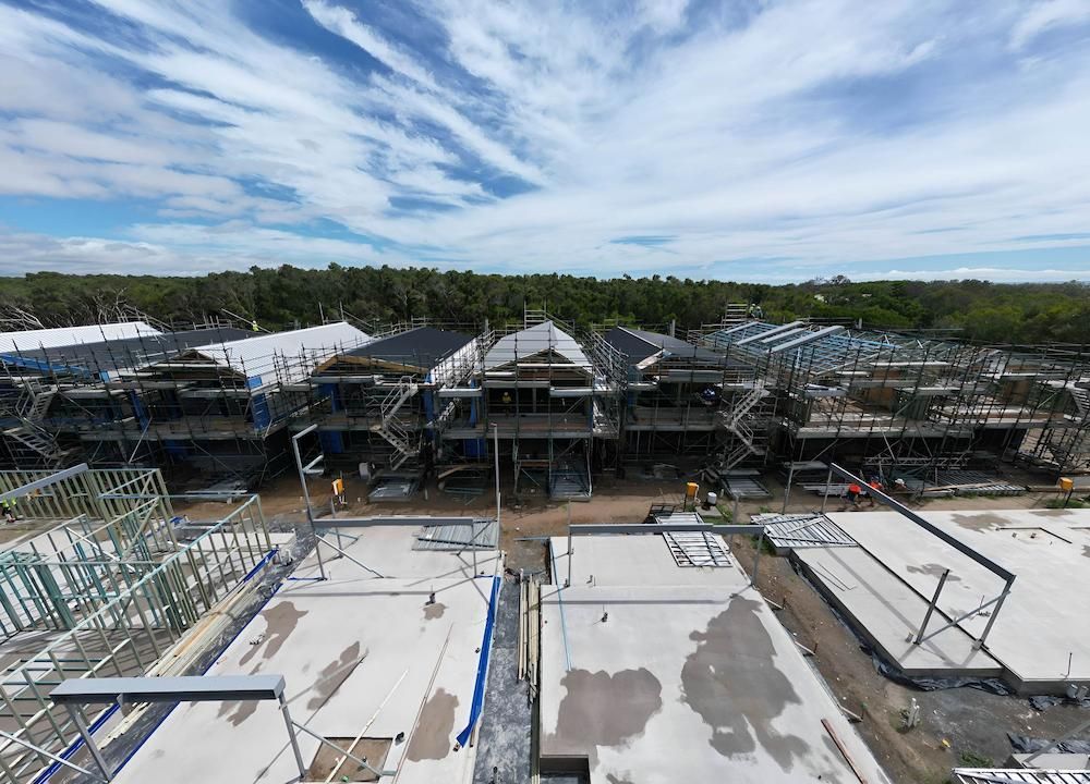 An Aerial View of a Building Under Construction on a Sunny Day — All Coast Scaffolding In Yandina, QLD