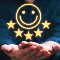 Smiling glowing face with stars above open hands on a dark background