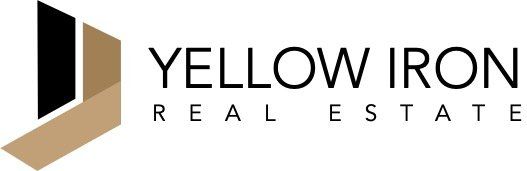 The logo for yellow iron real estate is black and gold.