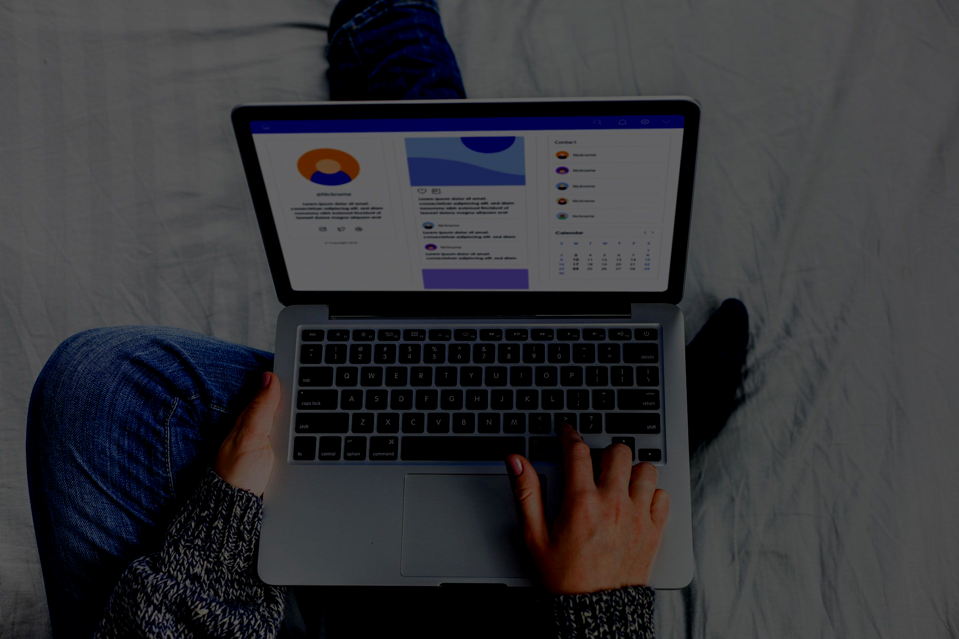 Person using a smartphone with a laptop and tablet on a desk; search bar overlay.