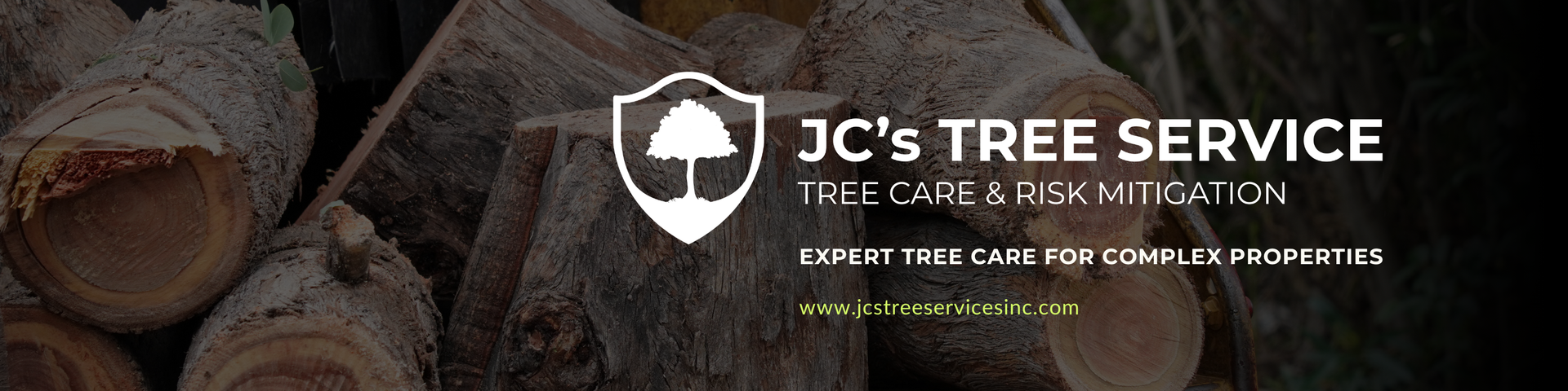 JC’s Tree Service logo on a dark wood background, with a shield icon and white text.