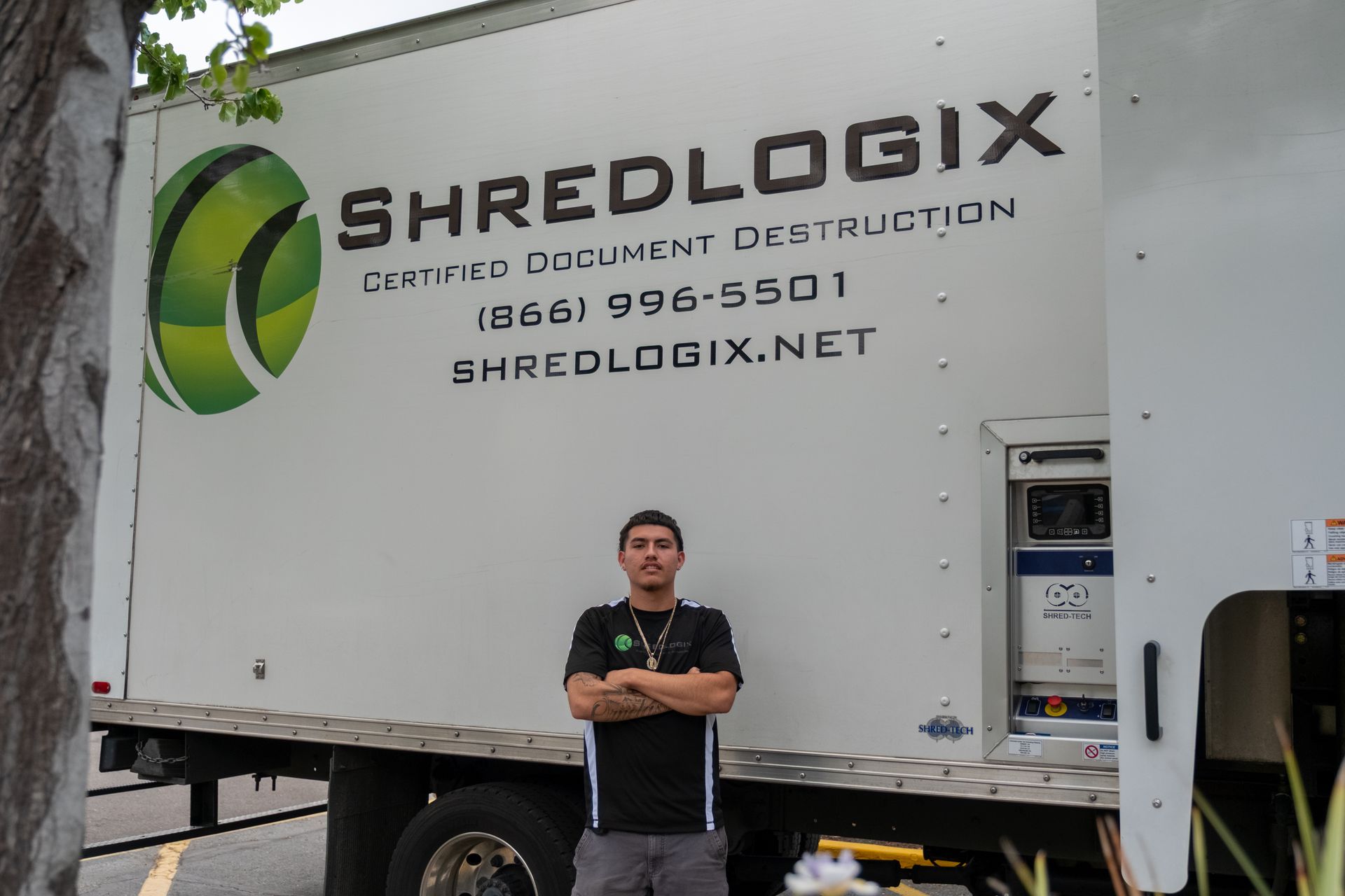 Man standing in front of a white 