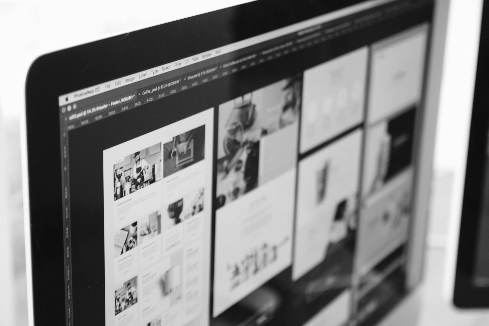 A black and white photo of a computer screen with a lot of pictures on it.