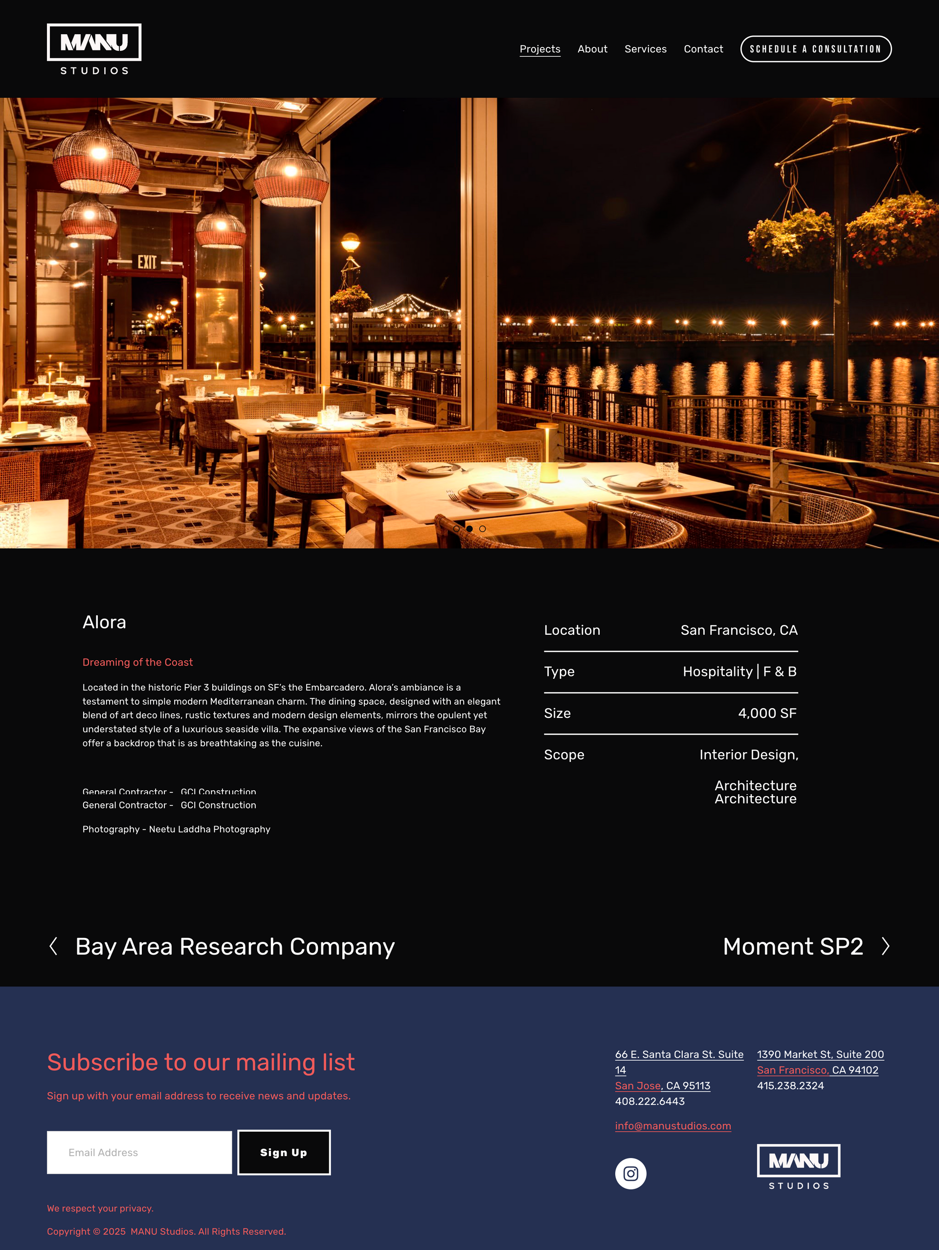 Elegant nighttime waterfront restaurant terrace with warm lighting and city lights beyond the railing