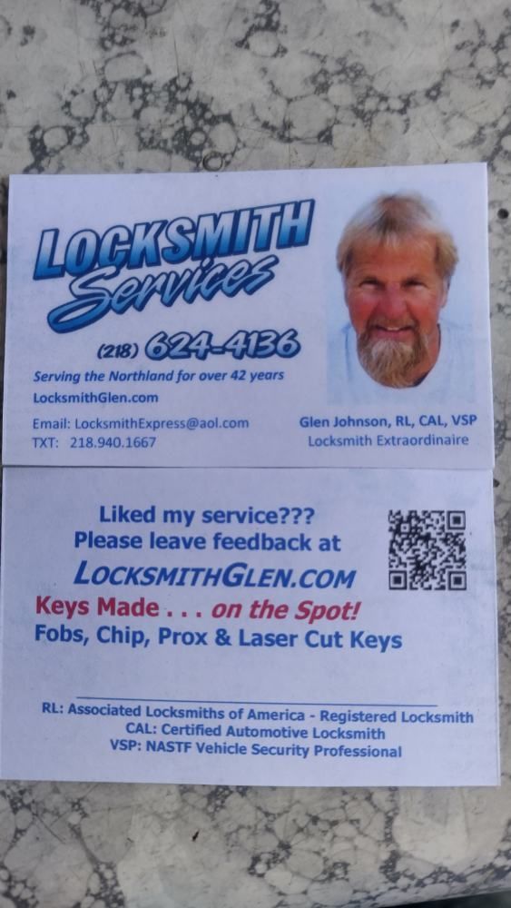 Business card for Locksmith Sarasota with blue text, QR code, and a man’s portrait on a stone background
