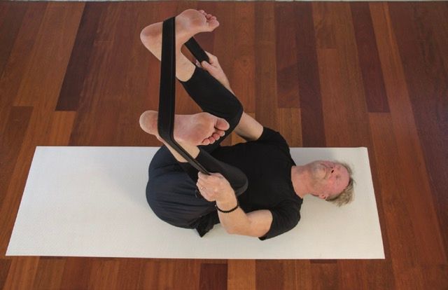 yin yoga 50 happy baby band pose photo