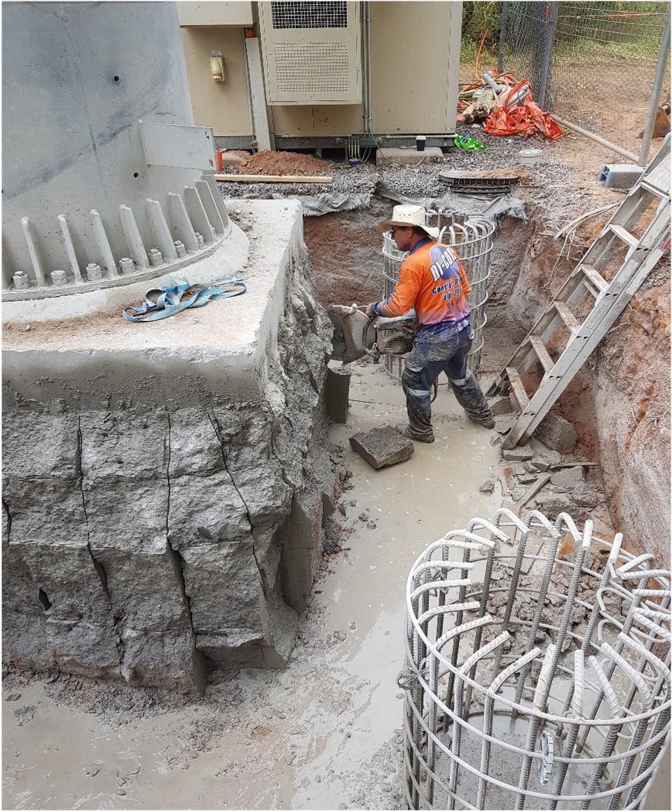 A Man is Using a Machine to Cut Concrete on a Communications Tower — Di-Core Drilling and Cutting in Darwin, NT