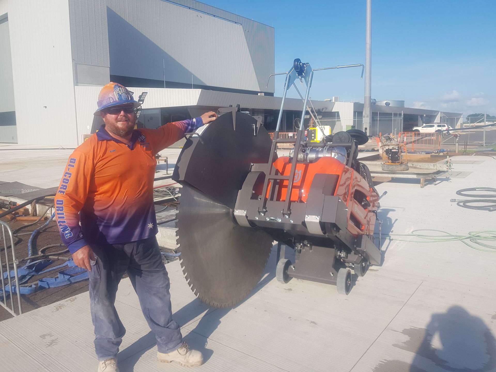 A Person is Cutting Concrete With a Circular Saw — Di-Core Drilling and Cutting in Darwin, NT