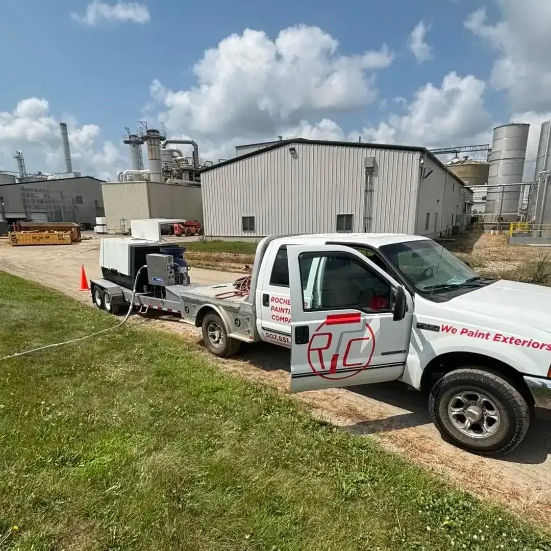 Rochester Painting Company truck and equipment at a commercial exterior painting project in Rochester, MN Rochester Painting Company truck and equipment at a commercial exterior painting project in Rochester, MN