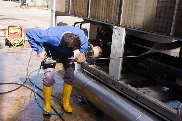 Man Washing with A Pressure Machine — Brookeville, MD — Smooth Bore Pressure Washing LLC