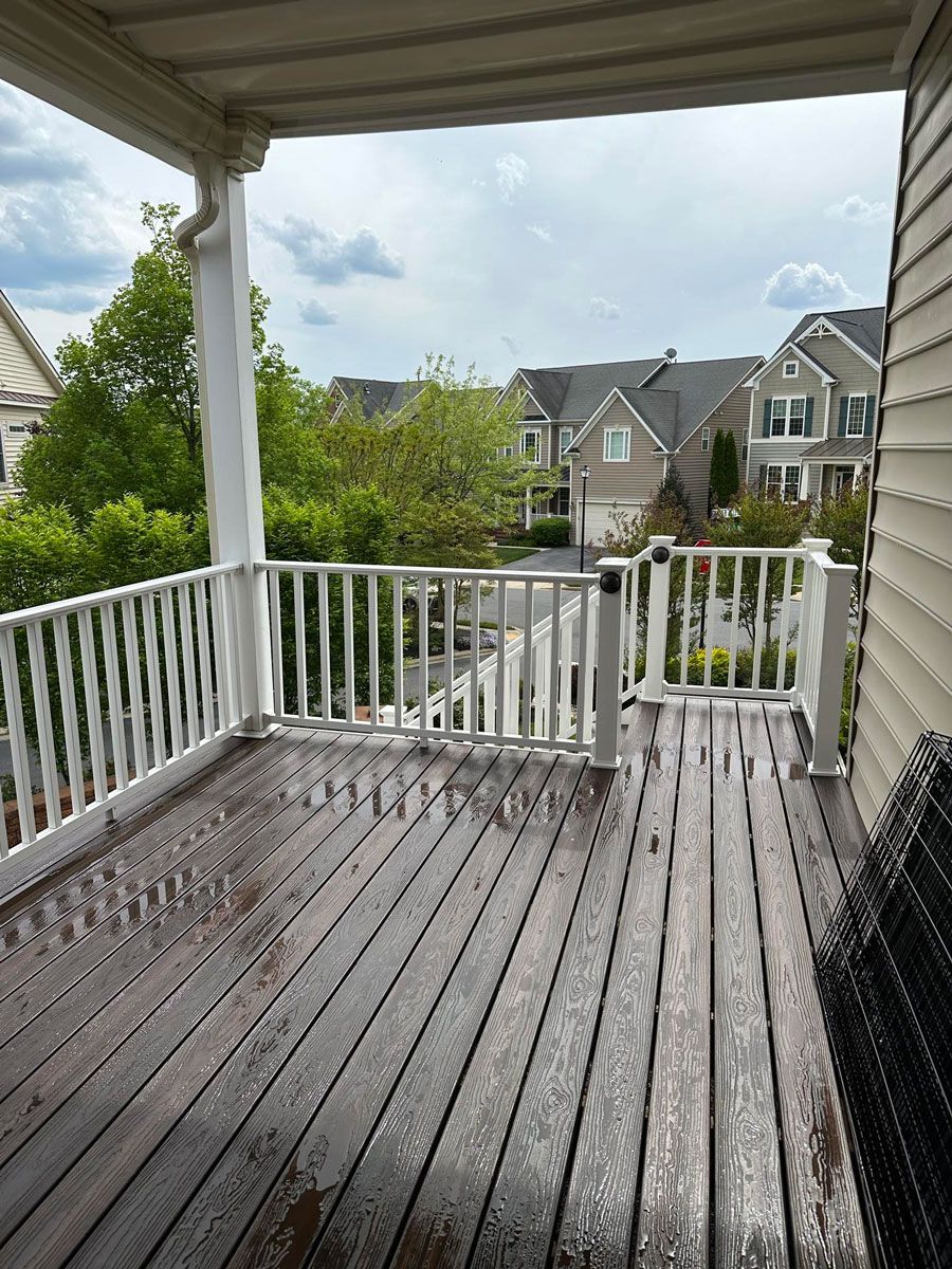 Wooden Deck with a White Railing — Brookeville, MD — Smooth Bore Pressure Washing LLC Wooden Deck with a White Railing — Brookeville, MD — Smooth Bore Pressure Washing LLC