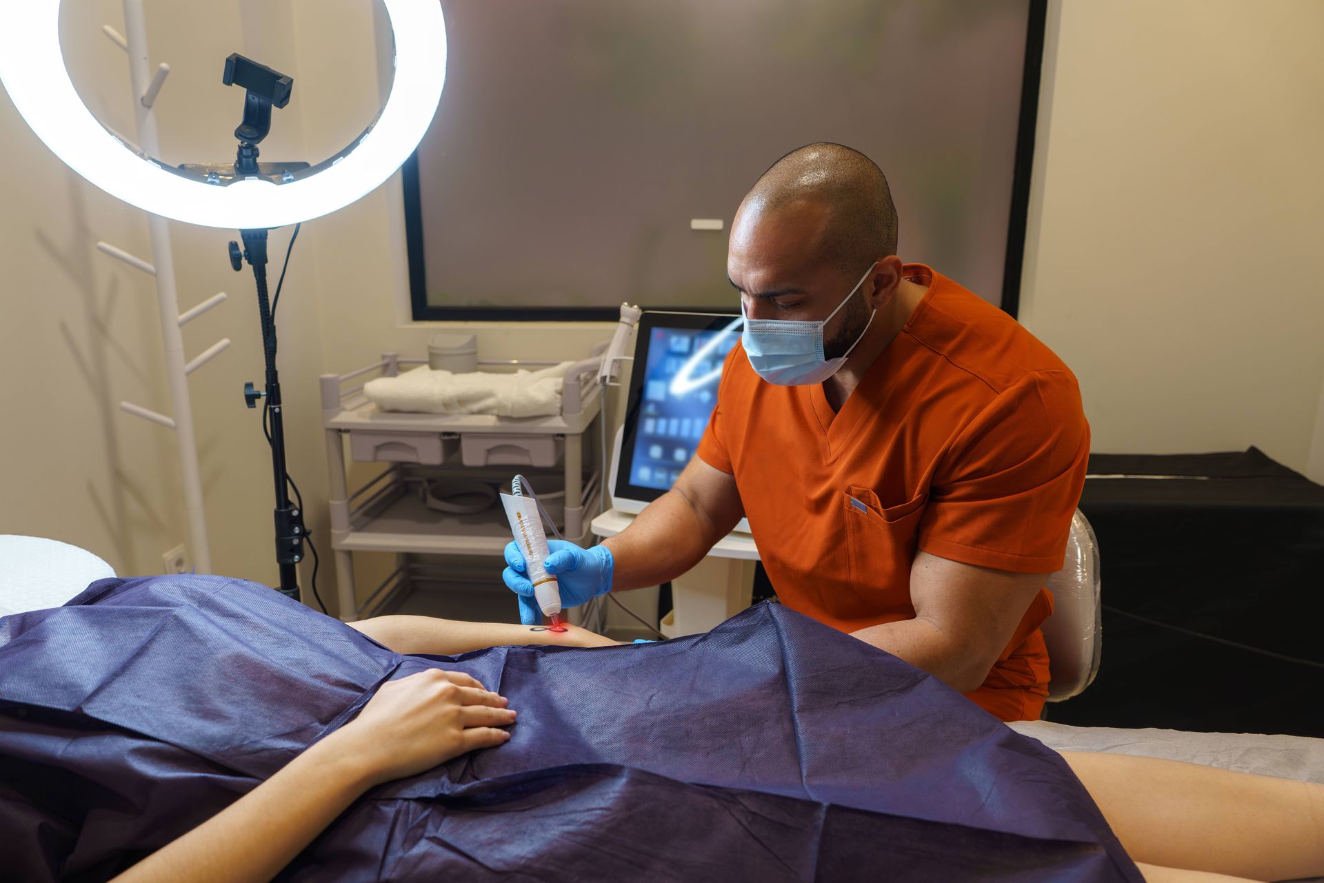 Someone getting a laser tattoo removal treatment at Lexington Tattoo Removal near Lexington, KY