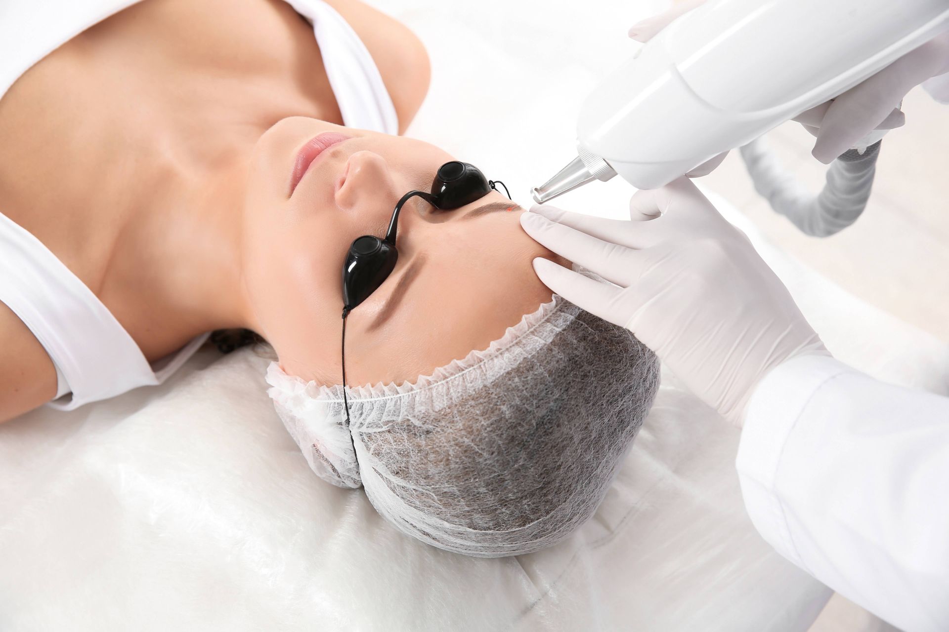 A woman getting laser microblading removal at Lexington Tattoo Removal near Lexington, KY