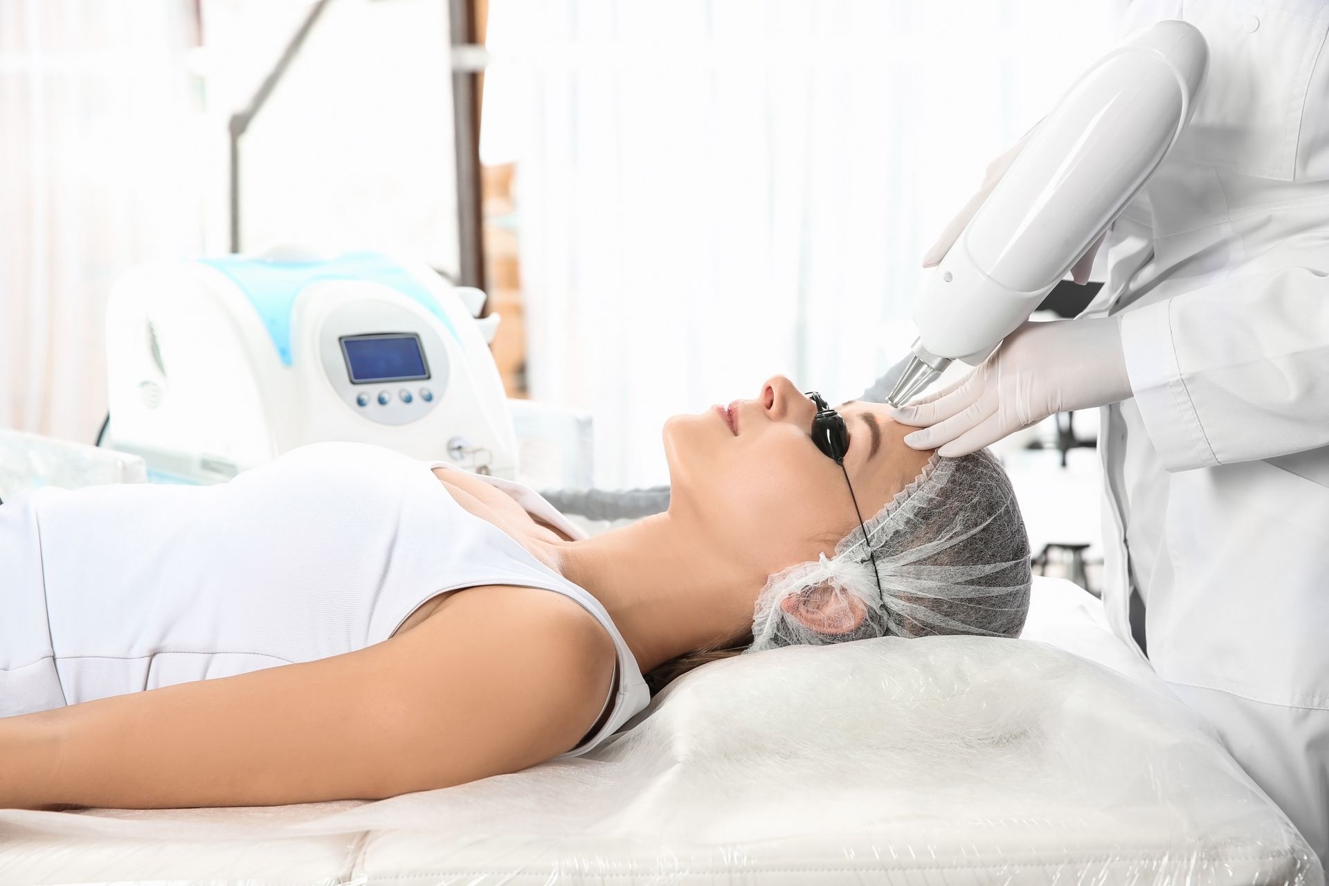 Someone receiving a laser microblading removal treatment 