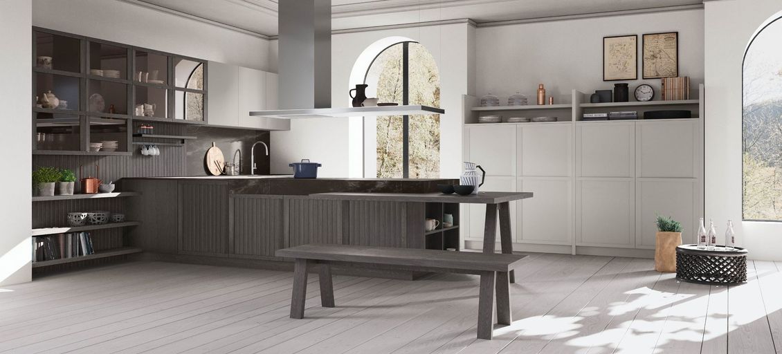 Una cucina con tavolo e panca