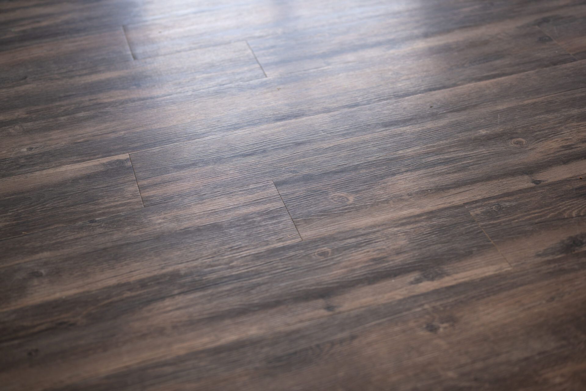 A close up of a wooden floor with a light shining on it at Ashford Villas in Chattanooga, TN.