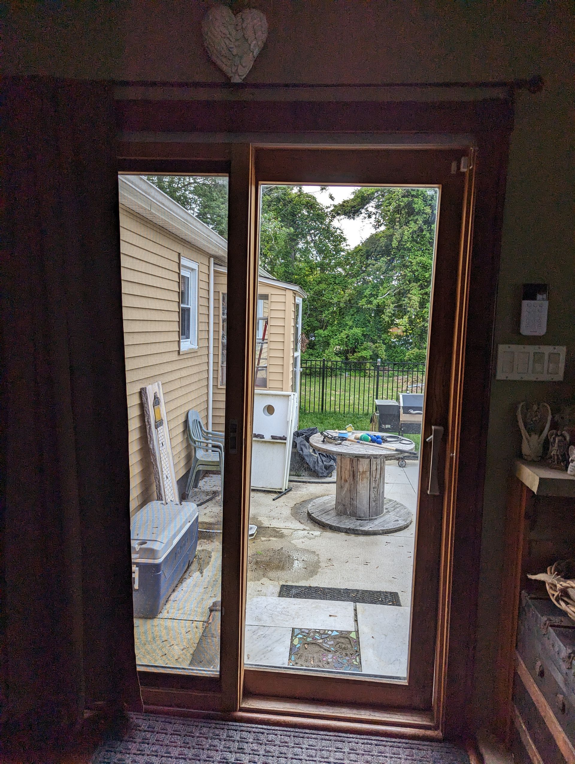A room with a sliding glass door leading to a patio