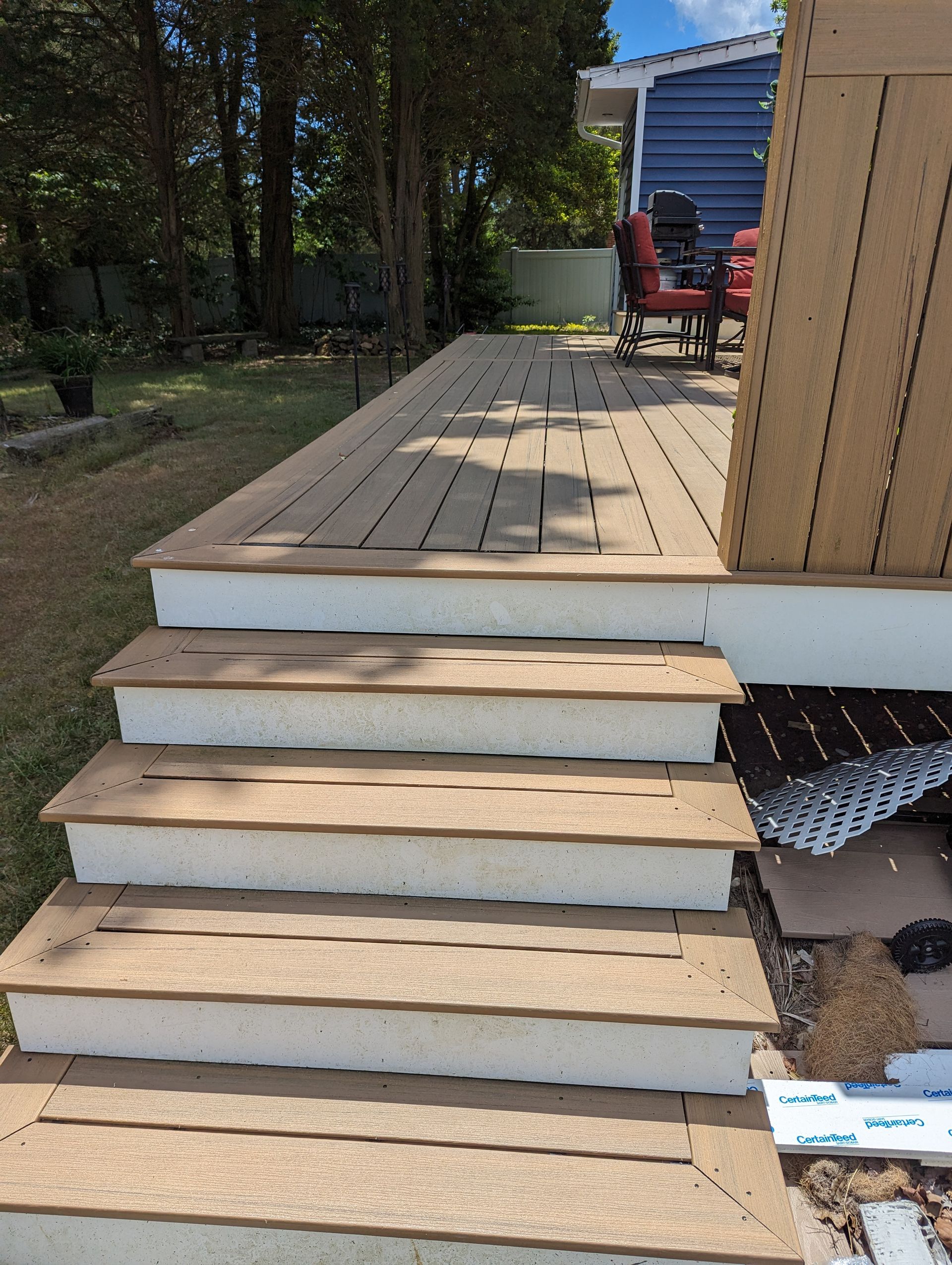 A deck with stairs leading up to it is being built.