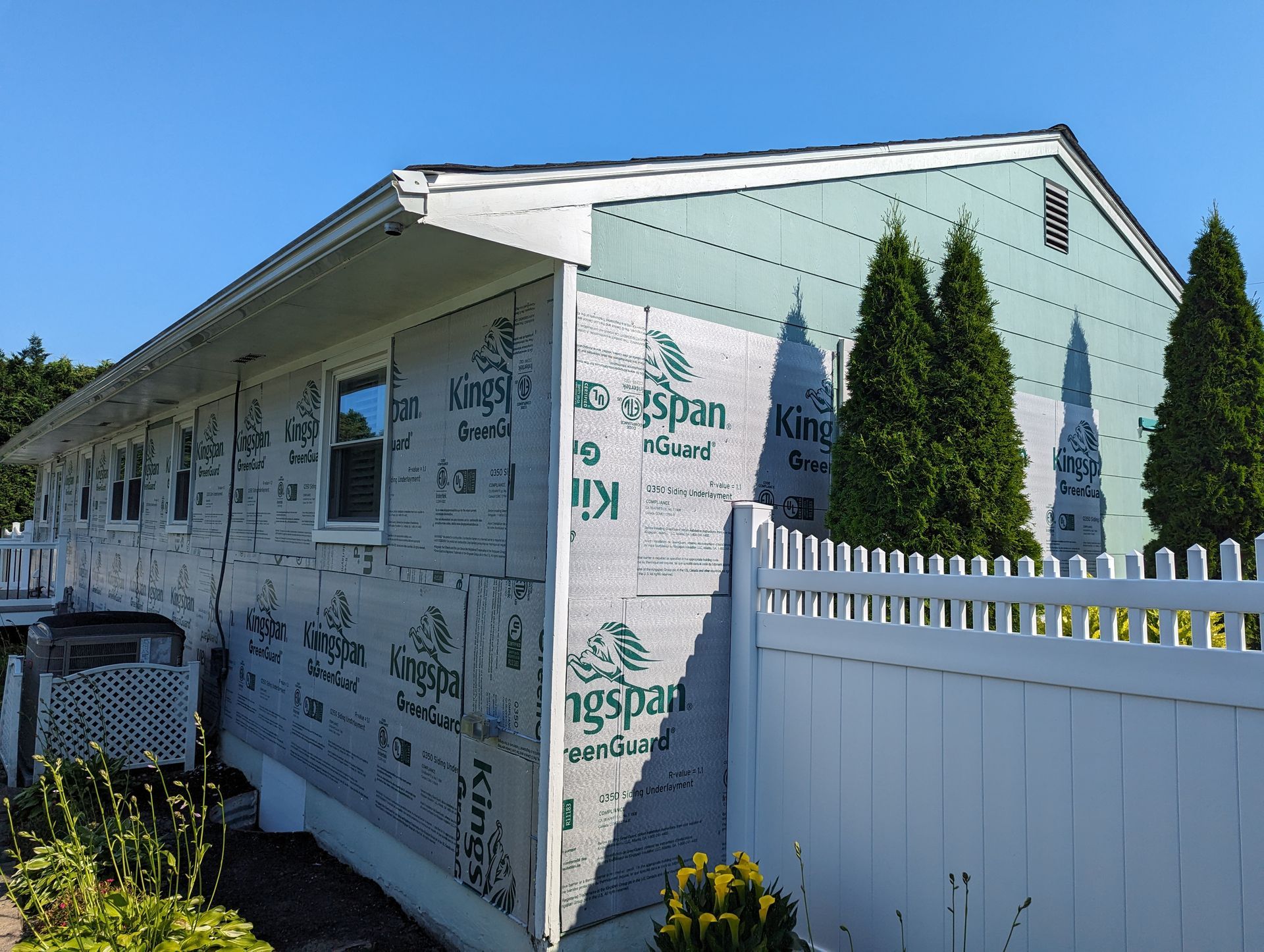 A house is being remodeled with kingspan siding.