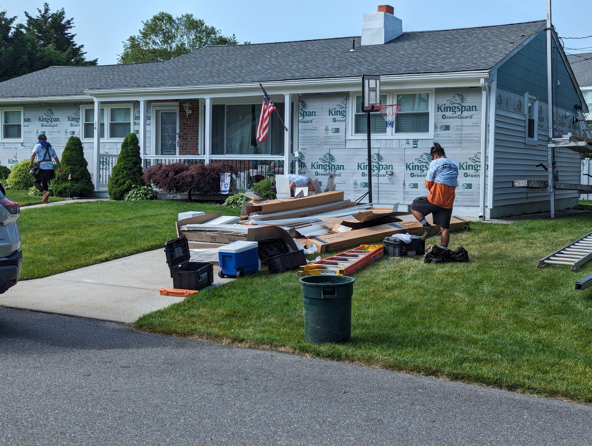 A man is working on the roof of a house.