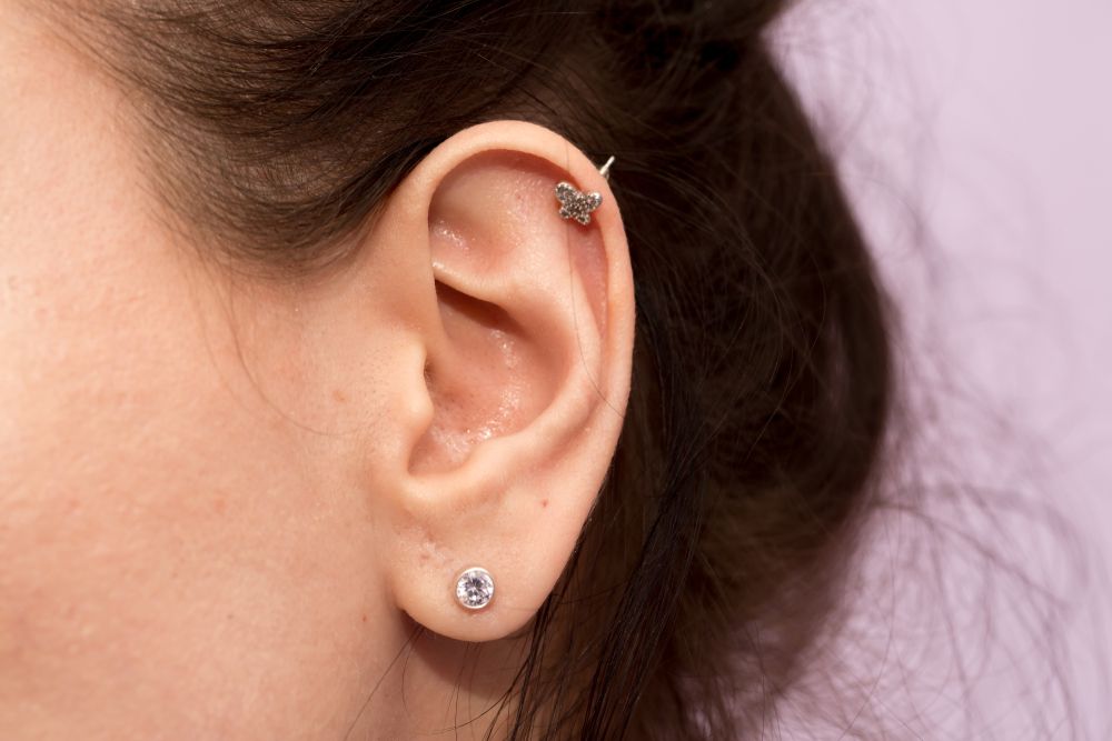 Close-up of a Person's Ear With Two Piercings — Aqua Marine Skin and Beauty in Forster, NSW