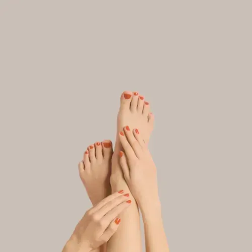 Woman's Feet With Red Nail Polish Crossed — Aqua Marine Skin and Beauty in Tuncurry, NSW