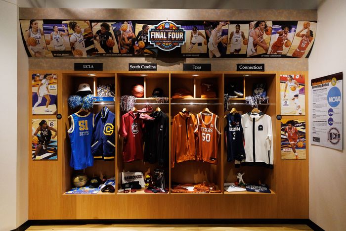 Museum exhibit with staircase, chairs, and “Wonders of the Game” display panels