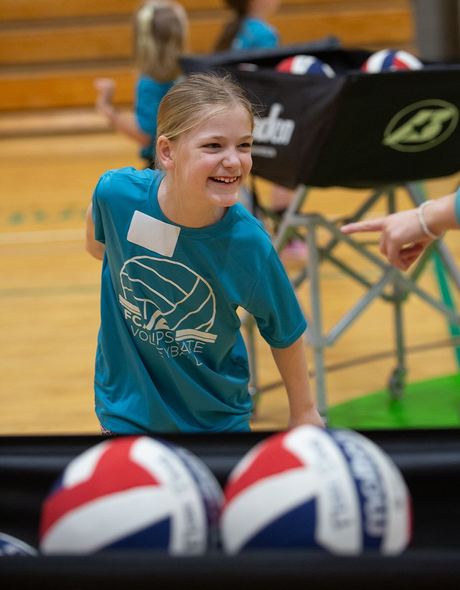 Young volleyball player smiling