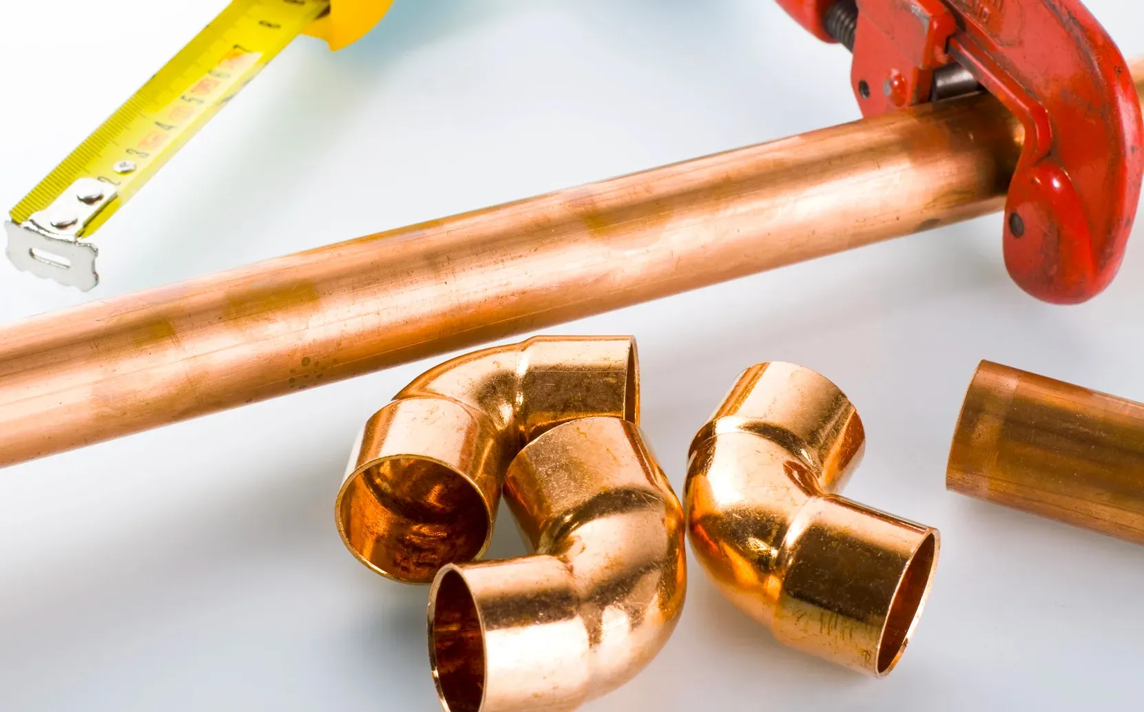 New copper pipes and fittings used for professional residential copper repiping and plumbing installation.