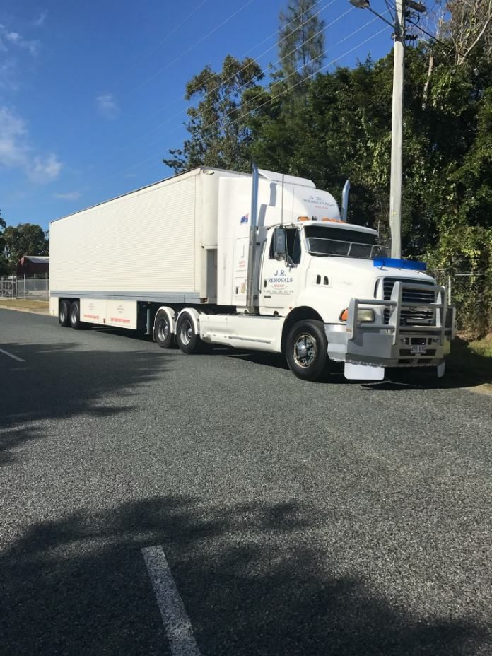 White Semi-trailer Truck Parked on a Road — JR Removals Mackay in Moranbah, QLD