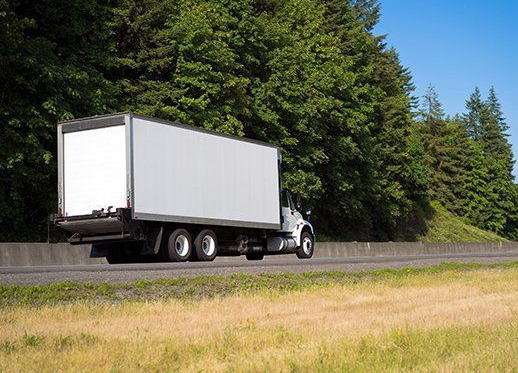 White Box Truck on Highway — JR Removals Mackay in Bucasia, QLD
