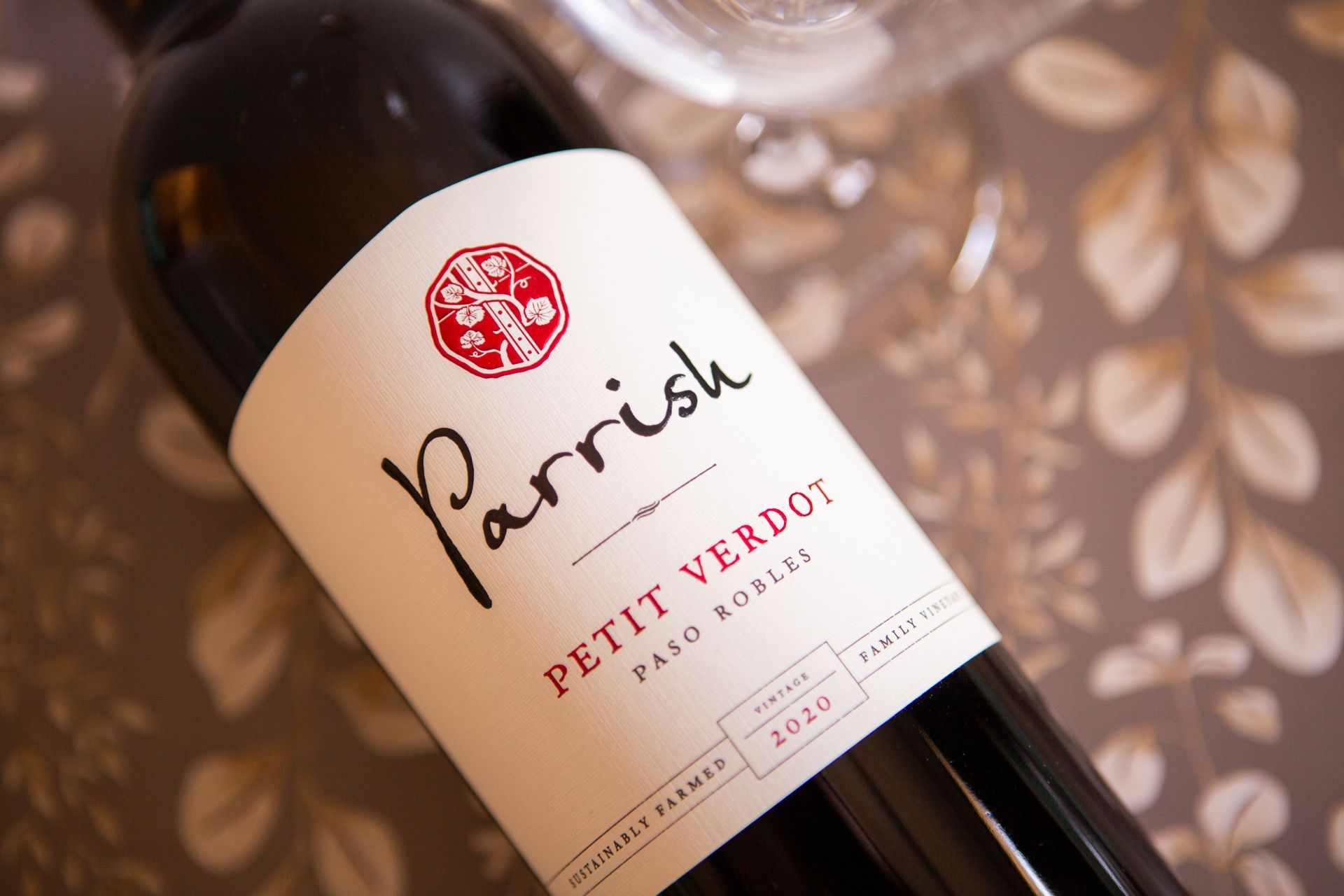 A bottle of parrish petit verdot wine is sitting on a table