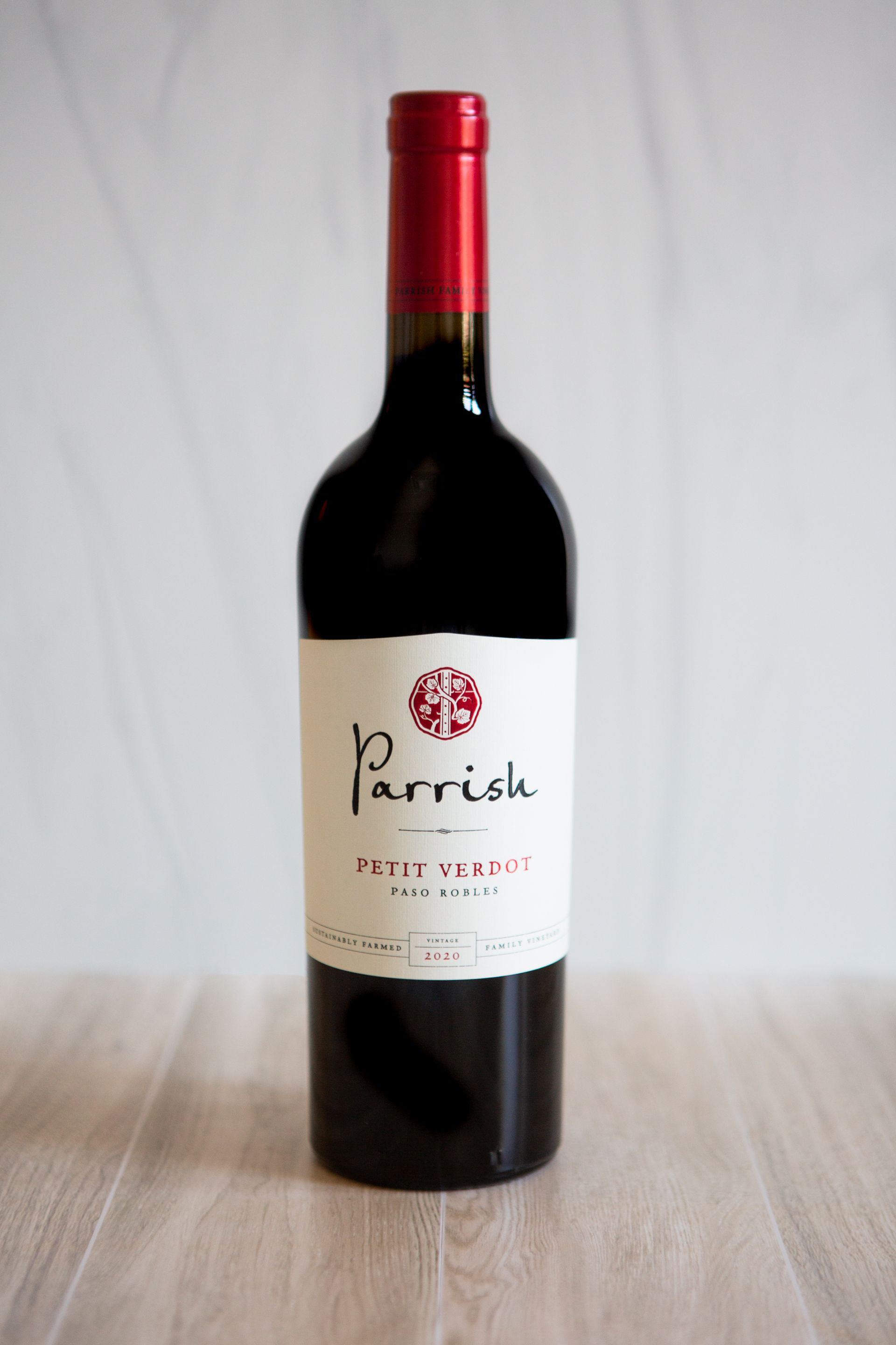 A bottle of Paso Robles 2020 Petit Verdot in front of a white background.