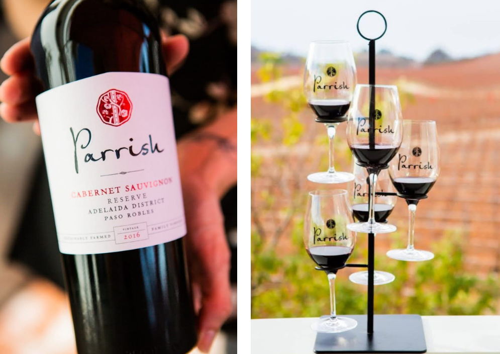 Bottle of Parrish Cabernet Sauvignon with a wine glass rack holding glasses.
